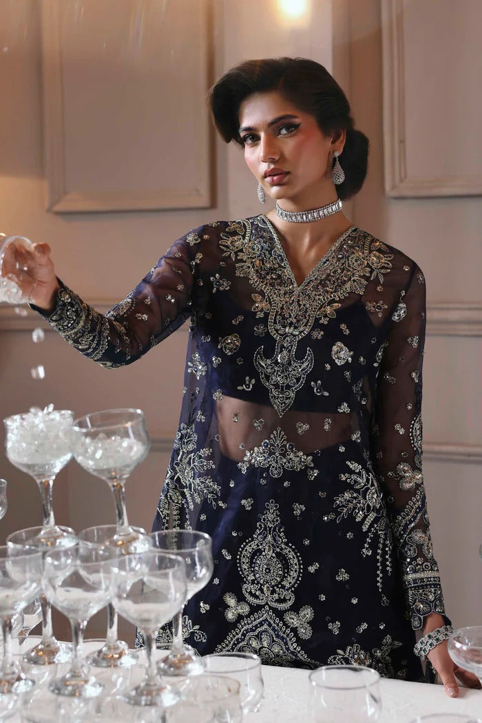 Elegant organza sharara outfit with embroidered front, back, sleeves & panels, paired with silk inner—crafted for a graceful and timeless look.