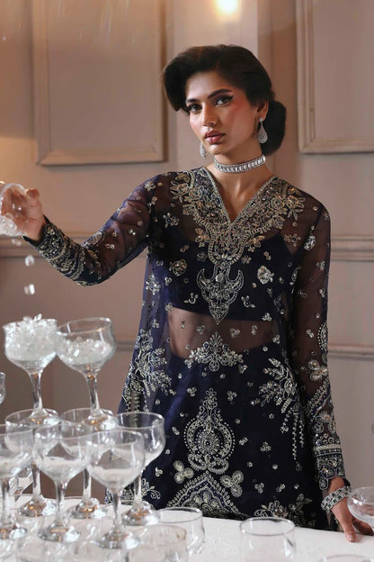 Elegant organza sharara outfit with embroidered front, back, sleeves & panels, paired with silk inner—crafted for a graceful and timeless look.
