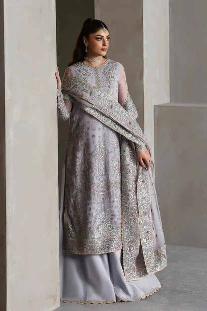 Graceful chiffon outfit with embroidered front, back, and sleeves enhanced by organza borders. Paired with a chiffon dupatta and raw silk trouser for elegance.