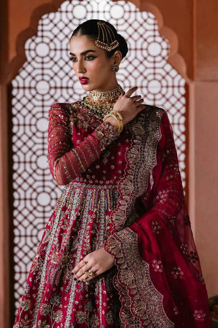 Graceful organza suit with embellished front panels, blouse, sleeves, dupatta & inner—crafted with fine embroidery for timeless elegance and charm.