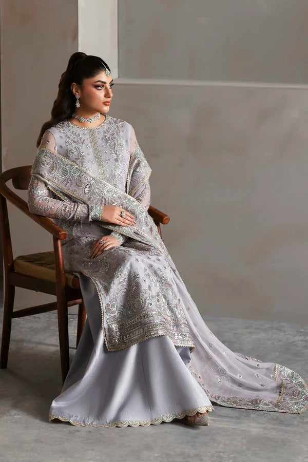 Graceful chiffon outfit with embroidered front, back, and sleeves enhanced by organza borders. Paired with a chiffon dupatta and raw silk trouser for elegance.