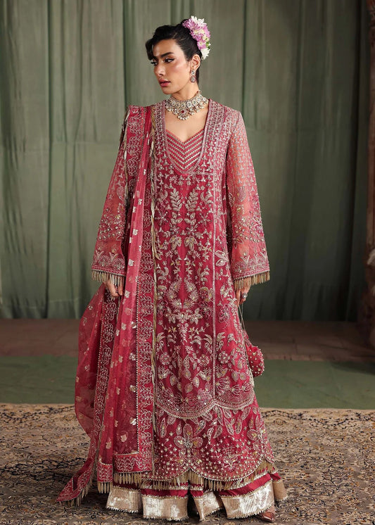 Step into elegance with this carrot pink organza ensemble featuring intricate hand embroidery, pure zari dupatta, and raw silk trouser for a refined look.