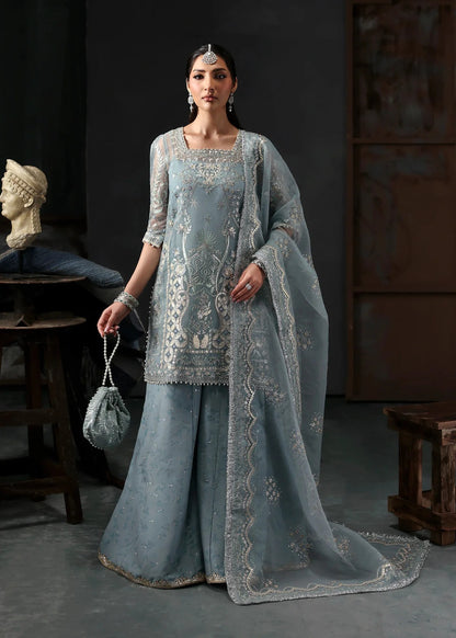 Chic ice blue organza dress with embroidered panels, dupatta & raw silk trouser. Available stitched/unstitch with custom sizing & worldwide delivery.