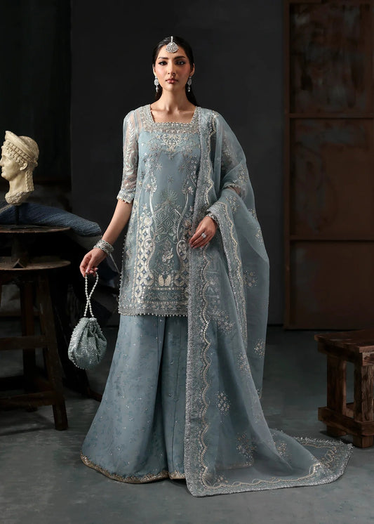 Chic ice blue organza dress with embroidered panels, dupatta & raw silk trouser. Available stitched/unstitch with custom sizing & worldwide delivery.