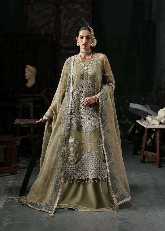 Graceful olive green organza suit with dori work, cutwork neckline, embroidered dupatta, and raw silk trouser a perfect choice for festive elegance.