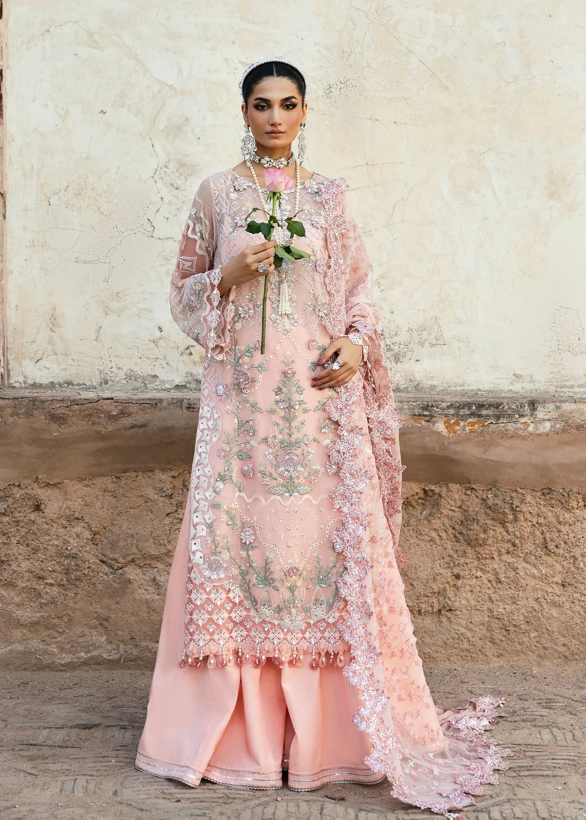 Luxury chiffon suit with 3D embellished front, organza cutwork borders, embroidered chiffon dupatta, and raw silk trouser — perfect for weddings & parties.