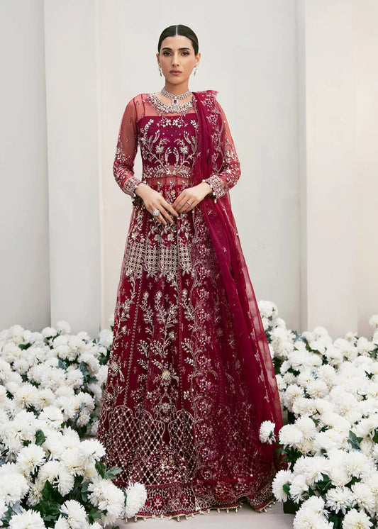 Graceful organza and poly net embroidered suit featuring hand-embellished bodice, cutwork panels, organza borders, dupatta, and raw silk trouser fabric.
