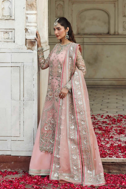Elegant organza outfit with hand-embellished panels, embroidered sleeves, dupatta, and raw silk trouser. A perfect blend of grace and luxury.