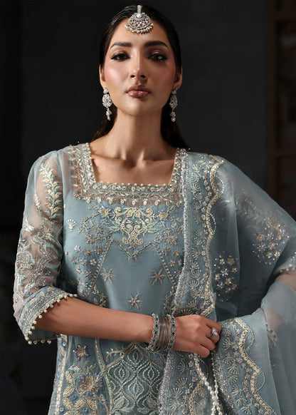 Chic ice blue organza dress with embroidered panels, dupatta & raw silk trouser. Available stitched/unstitch with custom sizing & worldwide delivery.