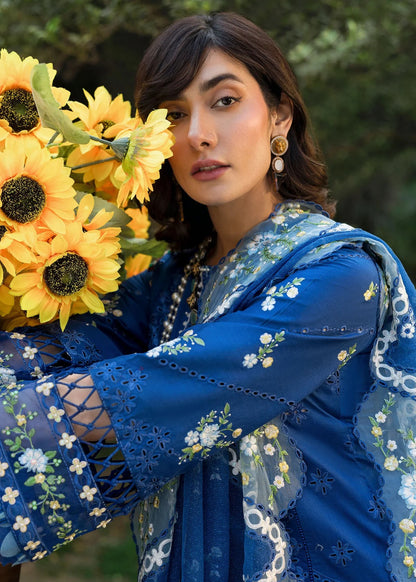 Step into elegance with this blue embroidered lawn suit featuring chikan-kari panels, hand-work neckline, net dupatta, and cotton trouser.