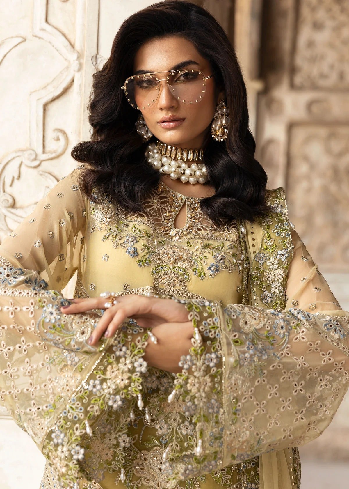 Graceful chiffon suit featuring luxury hand embellishment, cutwork organza borders, diamante & mukesh dupatta, paired with raw silk trouser.