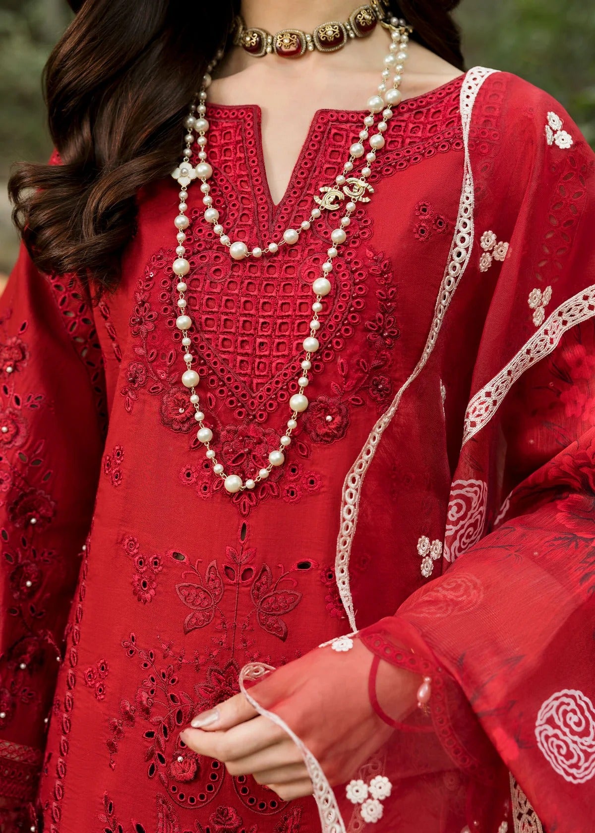 Stun in this maroon embroidered lawn suit with hand-work neckline, chikan-kari panels, 3D flowers, monar dupatta, and cotton trouser.