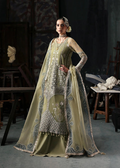 Graceful olive green organza suit with dori work, cutwork neckline, embroidered dupatta, and raw silk trouser a perfect choice for festive elegance.
