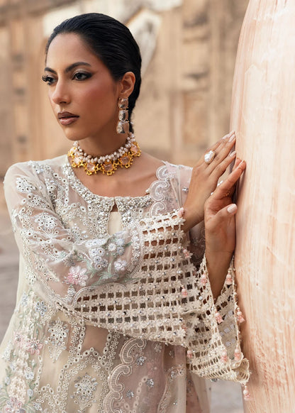 Elegant chiffon embroidered suit with hand embellishment, cutwork borders, diamante & mukesh dupatta, and raw silk trouser perfect for festive wear.
