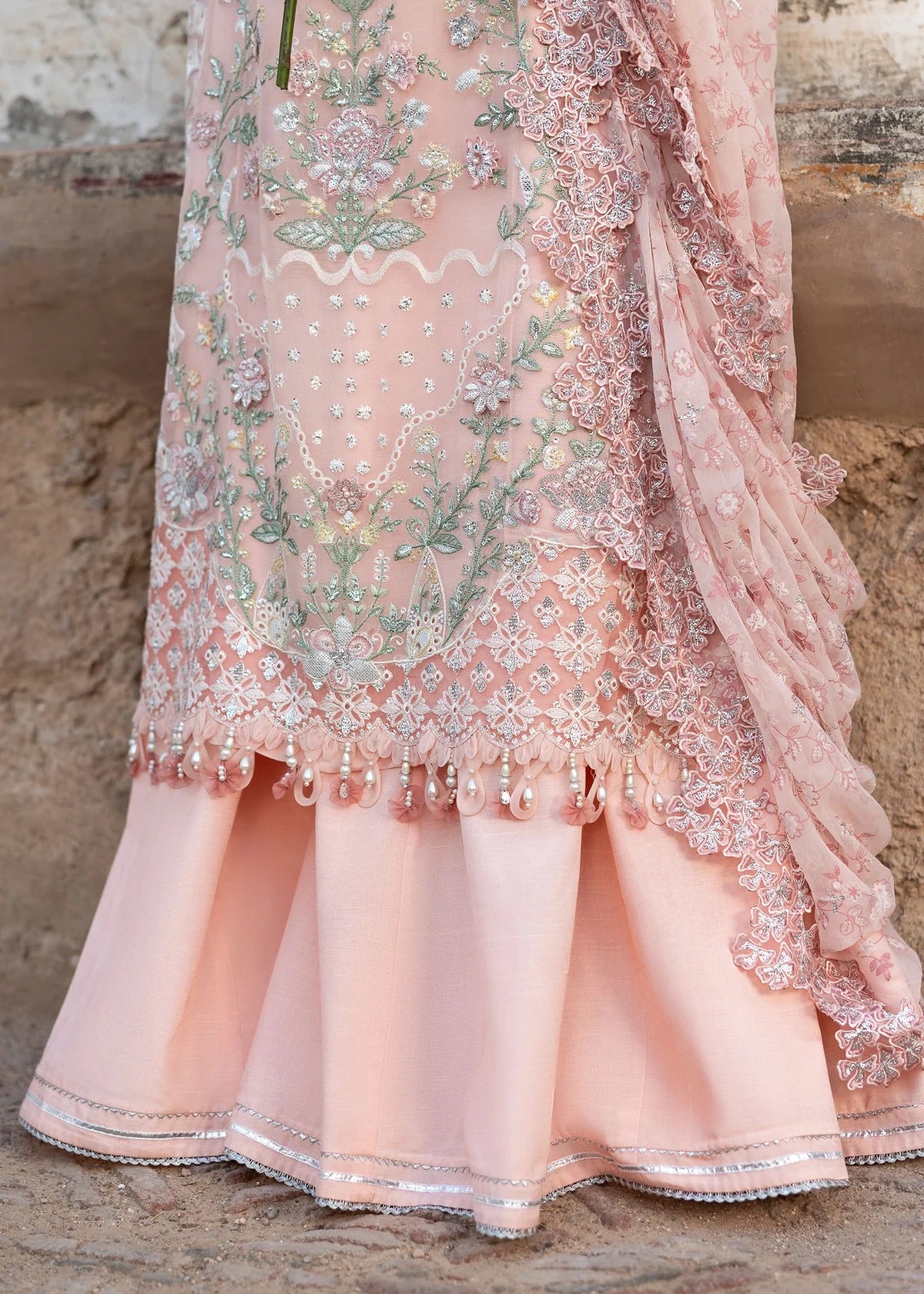 Luxury chiffon suit with 3D embellished front, organza cutwork borders, embroidered chiffon dupatta, and raw silk trouser — perfect for weddings & parties.