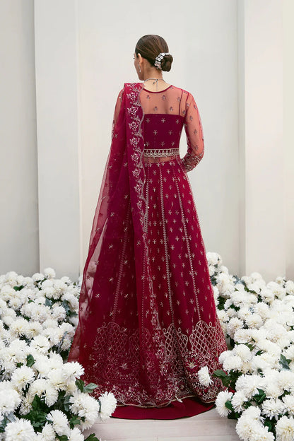 Graceful organza and poly net embroidered suit featuring hand-embellished bodice, cutwork panels, organza borders, dupatta, and raw silk trouser fabric.