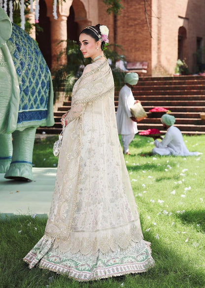 Elevate your look with this dusty white organza outfit featuring intricate hand embroidery, printed raw silk trouser, and elegant embroidered dupatta.