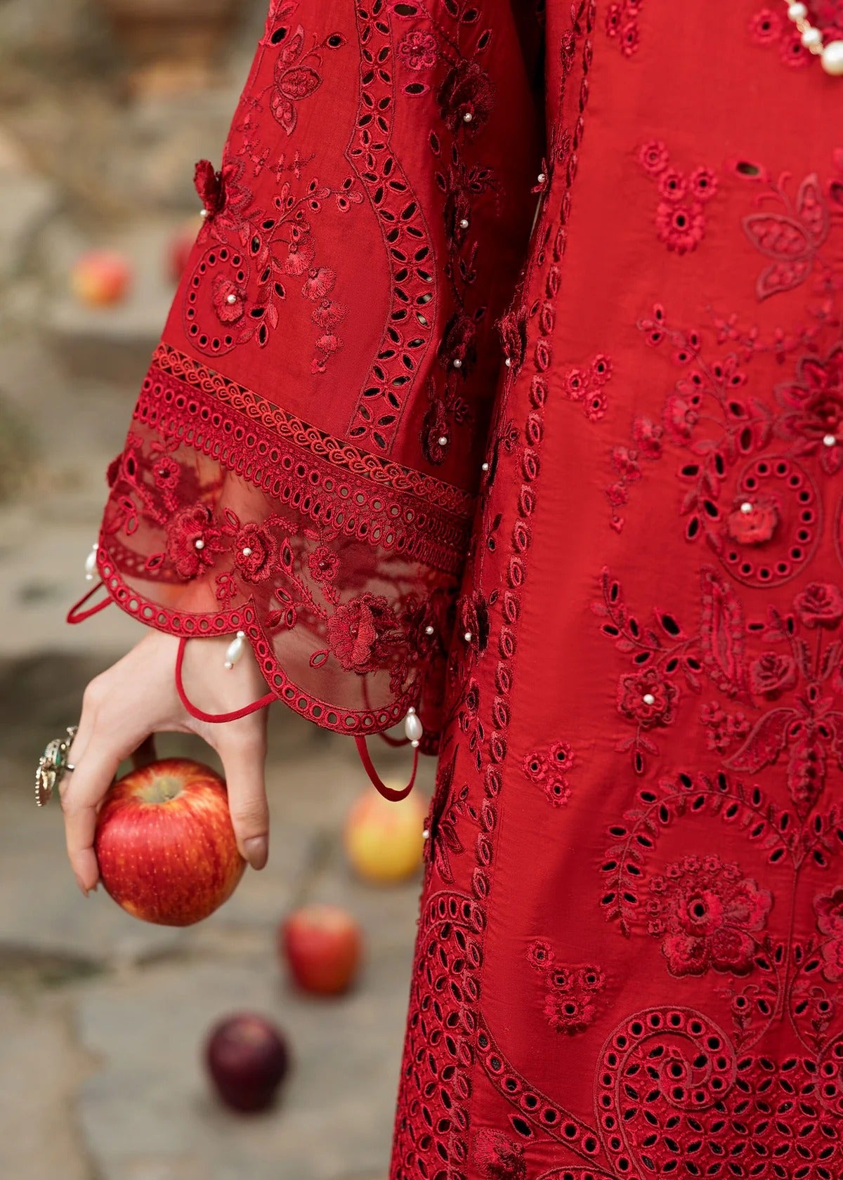 Stun in this maroon embroidered lawn suit with hand-work neckline, chikan-kari panels, 3D flowers, monar dupatta, and cotton trouser.