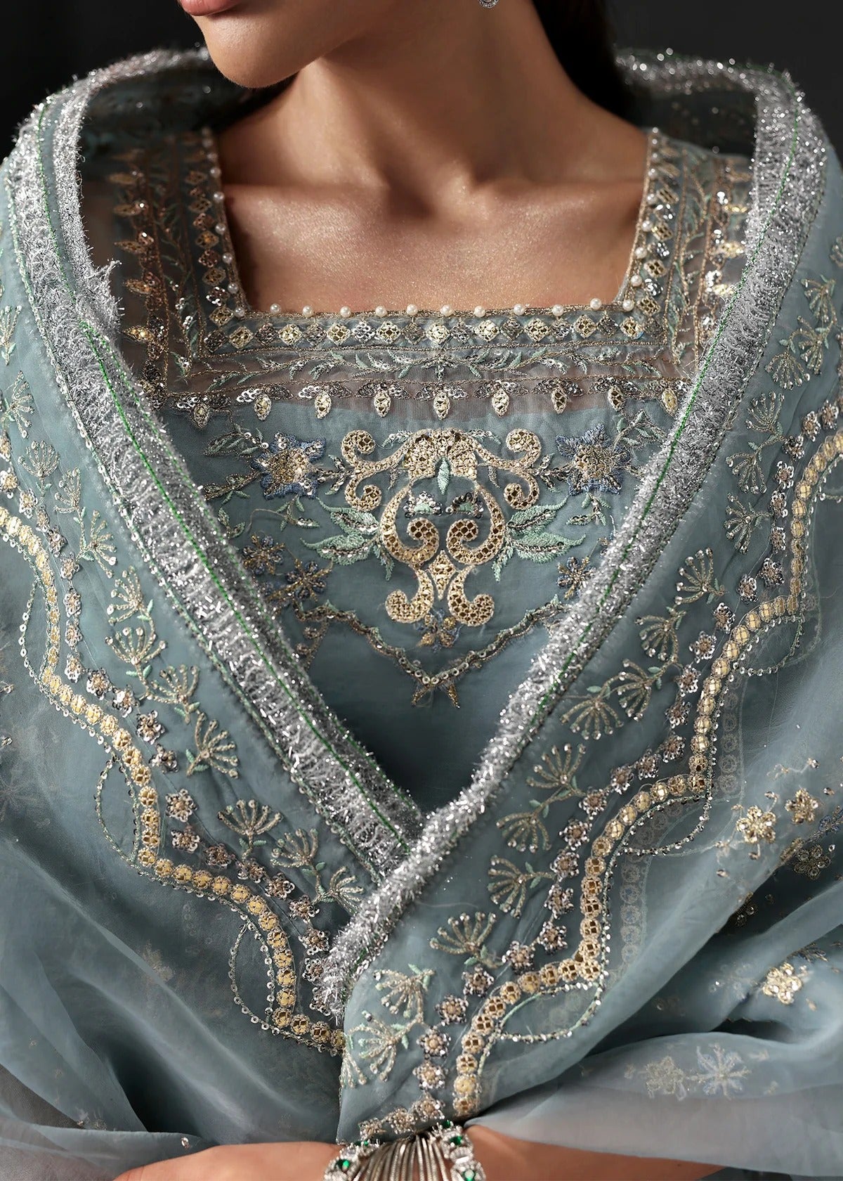 Chic ice blue organza dress with embroidered panels, dupatta & raw silk trouser. Available stitched/unstitch with custom sizing & worldwide delivery.