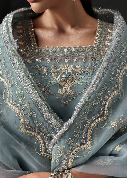 Chic ice blue organza dress with embroidered panels, dupatta & raw silk trouser. Available stitched/unstitch with custom sizing & worldwide delivery.