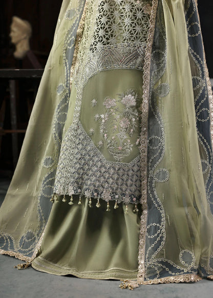 Graceful olive green organza suit with dori work, cutwork neckline, embroidered dupatta, and raw silk trouser a perfect choice for festive elegance.