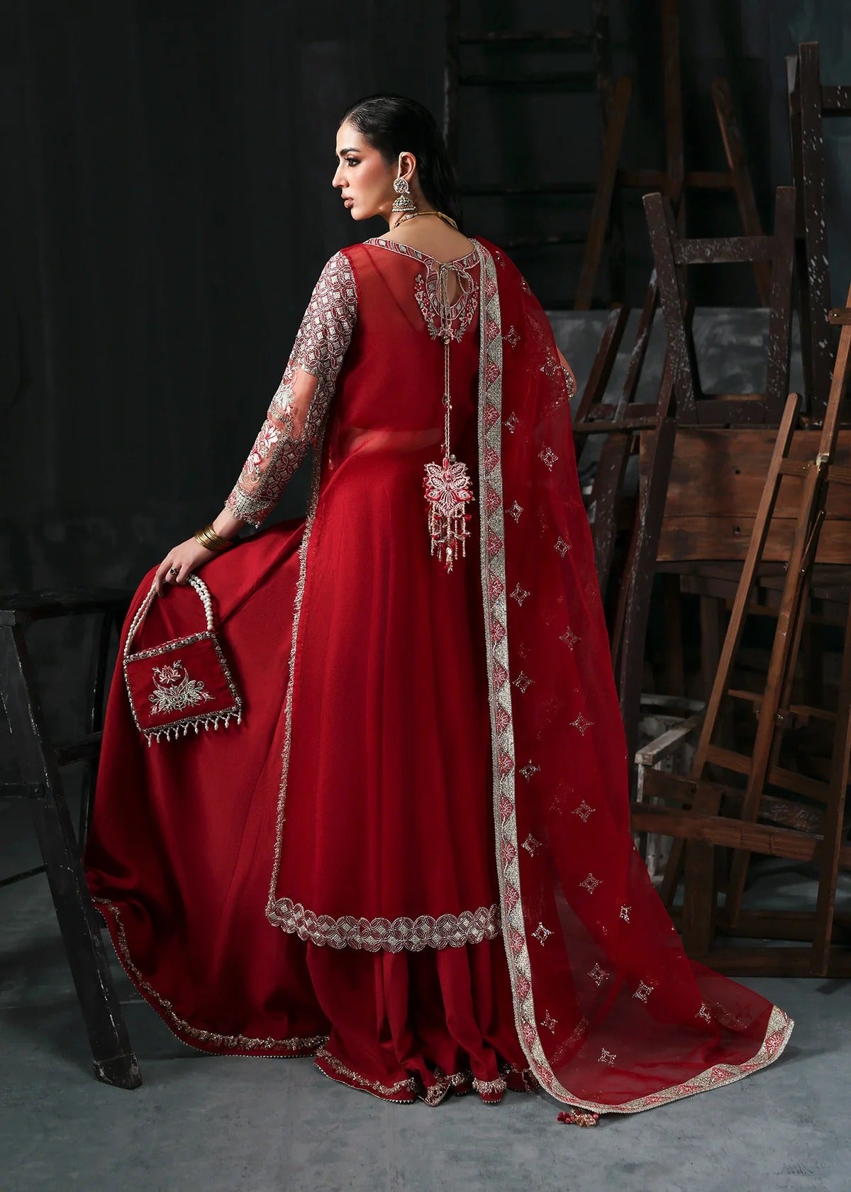 Stunning red organza dress with cutwork neckline, embroidered panels, dupatta & raw silk trouser. Available stitched/unstitch with custom sizing.