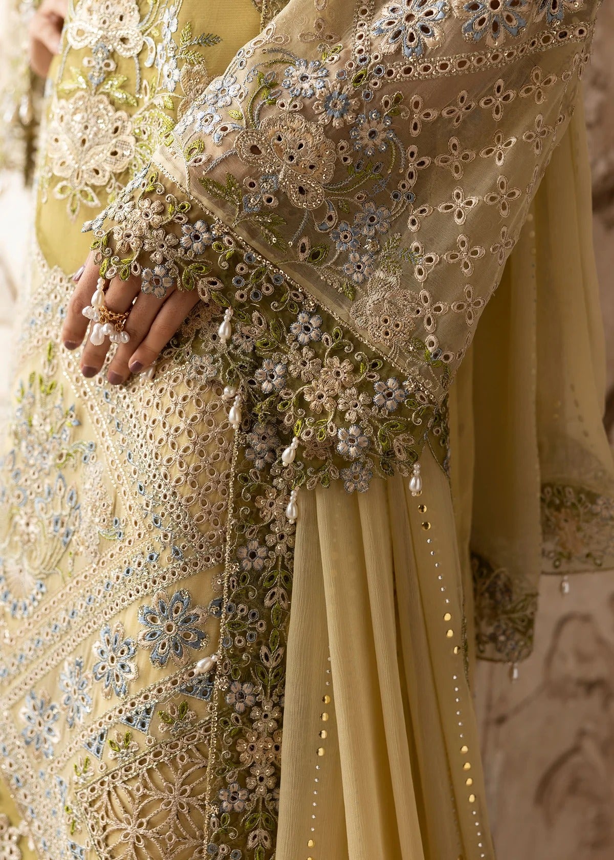 Graceful chiffon suit featuring luxury hand embellishment, cutwork organza borders, diamante & mukesh dupatta, paired with raw silk trouser.