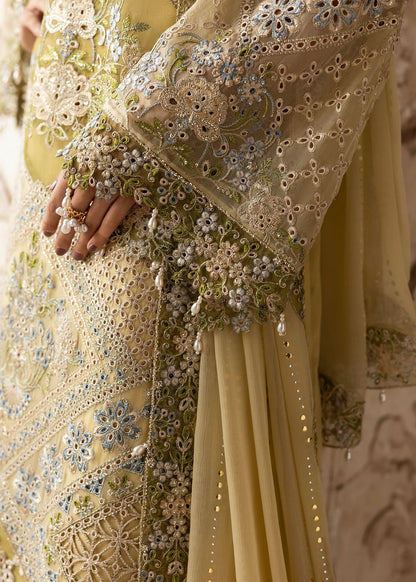 Graceful chiffon suit featuring luxury hand embellishment, cutwork organza borders, diamante & mukesh dupatta, paired with raw silk trouser.