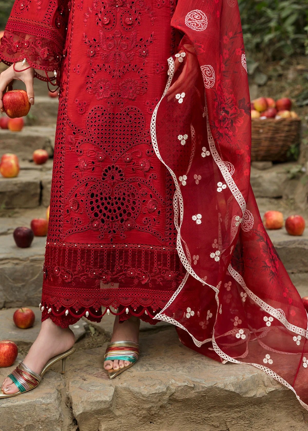 Stun in this maroon embroidered lawn suit with hand-work neckline, chikan-kari panels, 3D flowers, monar dupatta, and cotton trouser.