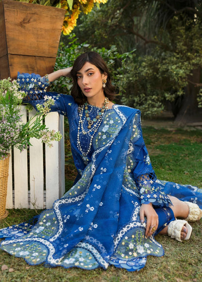 Step into elegance with this blue embroidered lawn suit featuring chikan-kari panels, hand-work neckline, net dupatta, and cotton trouser.