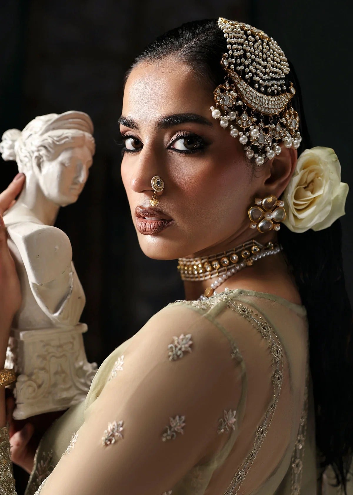 Graceful olive green organza suit with dori work, cutwork neckline, embroidered dupatta, and raw silk trouser a perfect choice for festive elegance.
