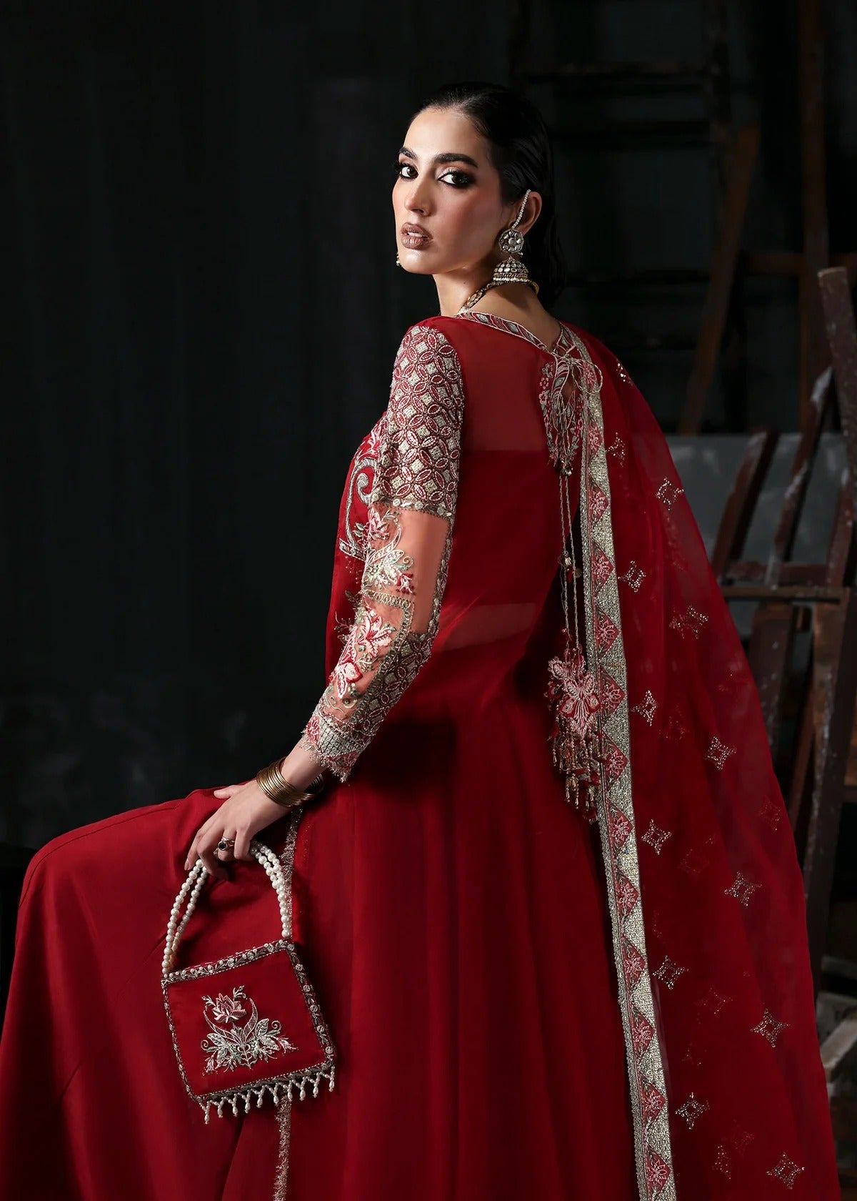 Stunning red organza dress with cutwork neckline, embroidered panels, dupatta & raw silk trouser. Available stitched/unstitch with custom sizing.