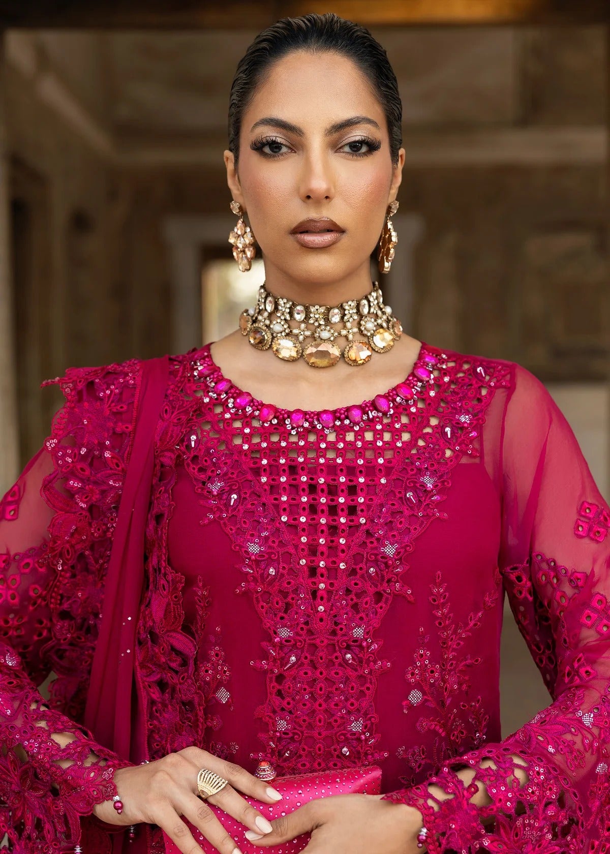 Elegant chiffon suit with hand-embellished neckline, cutwork borders, diamante dupatta with organza motifs, and raw silk trouser — ideal for festive wear.