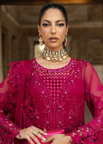 Elegant chiffon suit with hand-embellished neckline, cutwork borders, diamante dupatta with organza motifs, and raw silk trouser — ideal for festive wear.
