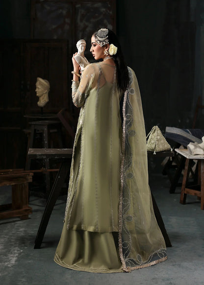 Graceful olive green organza suit with dori work, cutwork neckline, embroidered dupatta, and raw silk trouser a perfect choice for festive elegance.