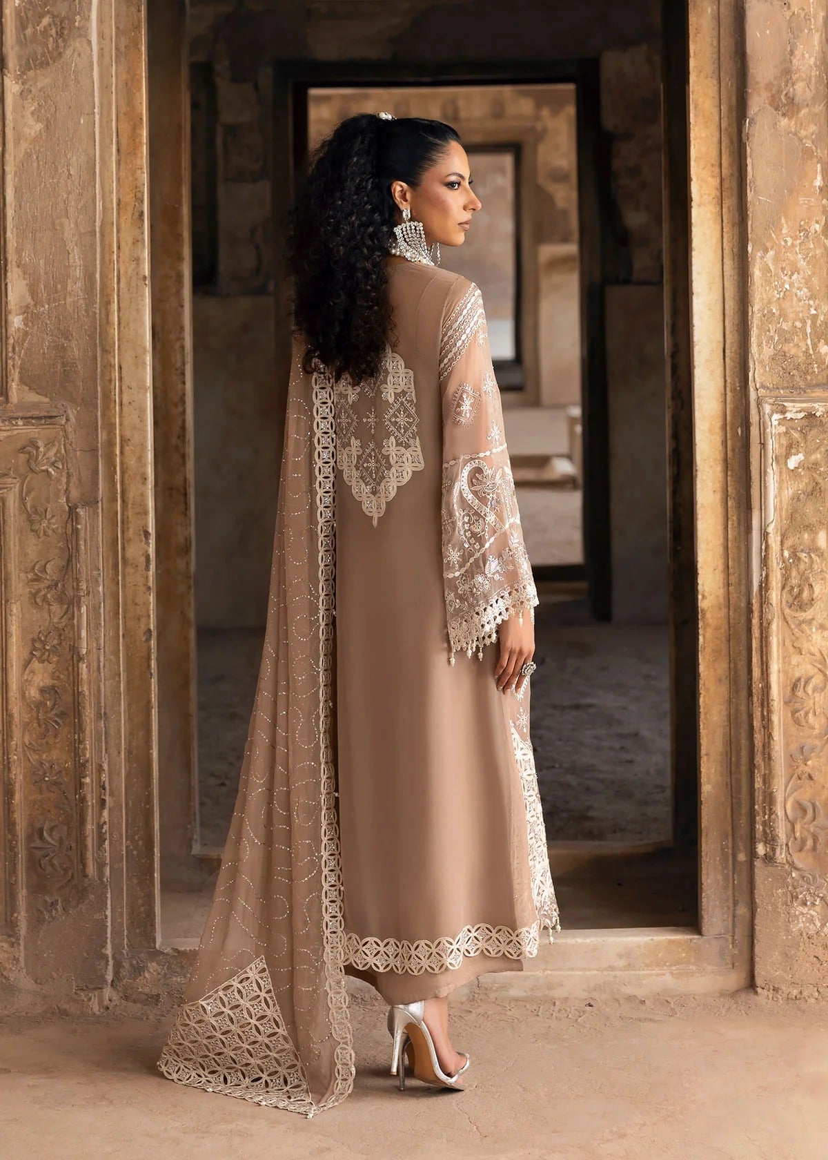 Exquisite chiffon suit with luxury hand embellishment, cutwork organza borders, embroidered dupatta, and raw silk trouser — ideal for weddings & parties.