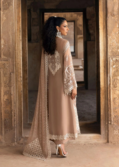 Exquisite chiffon suit with luxury hand embellishment, cutwork organza borders, embroidered dupatta, and raw silk trouser — ideal for weddings & parties.