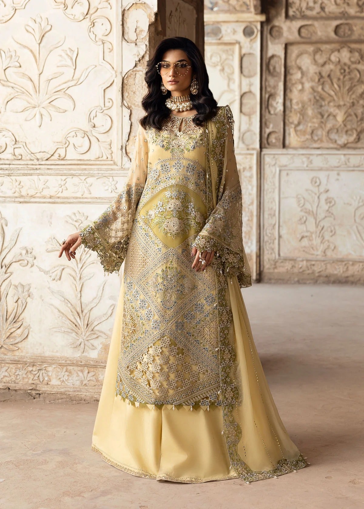 Graceful chiffon suit featuring luxury hand embellishment, cutwork organza borders, diamante & mukesh dupatta, paired with raw silk trouser.