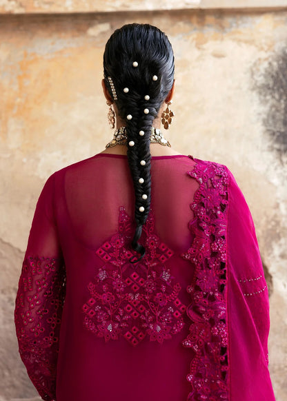Elegant chiffon suit with hand-embellished neckline, cutwork borders, diamante dupatta with organza motifs, and raw silk trouser — ideal for festive wear.