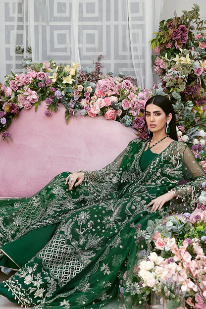 Luxury poly net embroidered suit with hand-embellished panels, cutwork sleeves, organza borders, embroidered dupatta, and raw silk trouser fabric.