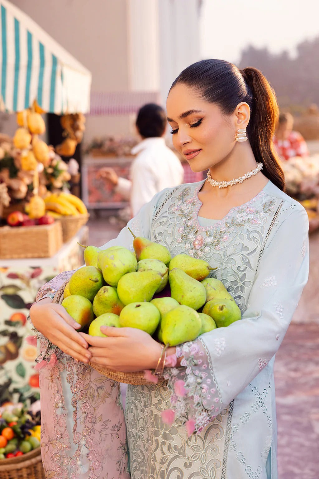 Elegant embroidered lawn suit with handwork neckline, chikan-kari panels, organza borders, woven net digital print dupatta, and cotton trouser.