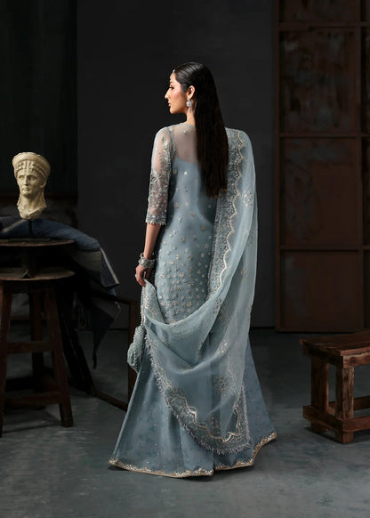 Chic ice blue organza dress with embroidered panels, dupatta & raw silk trouser. Available stitched/unstitch with custom sizing & worldwide delivery.