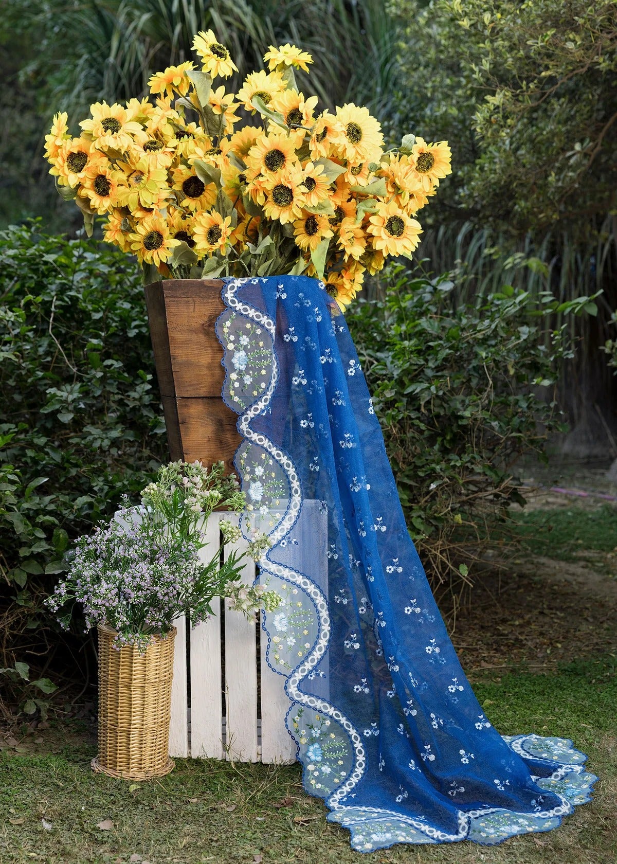 Step into elegance with this blue embroidered lawn suit featuring chikan-kari panels, hand-work neckline, net dupatta, and cotton trouser.