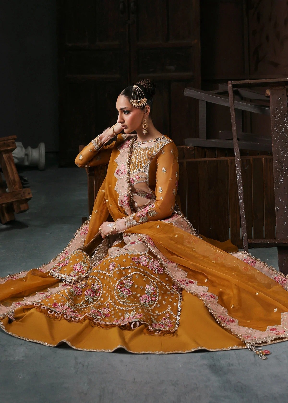 Chic mustard organza suit with applique front, embroidered neckline, dupatta with 4-side border, and raw silk trouser — perfect for festive wear.