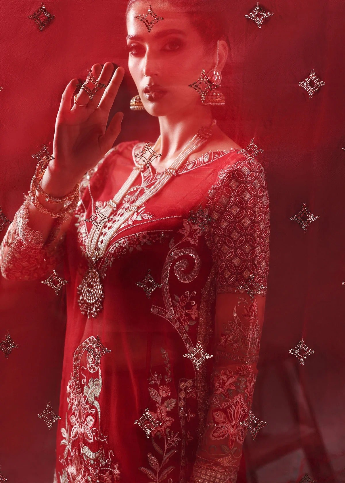 Stunning red organza dress with cutwork neckline, embroidered panels, dupatta & raw silk trouser. Available stitched/unstitch with custom sizing.