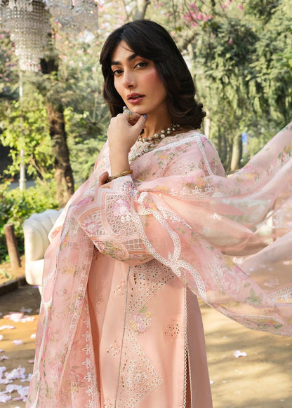 Grace your look with this peach embroidered lawn suit featuring chikan-kari panels, hand-work neckline, net dupatta, and cotton trouser.