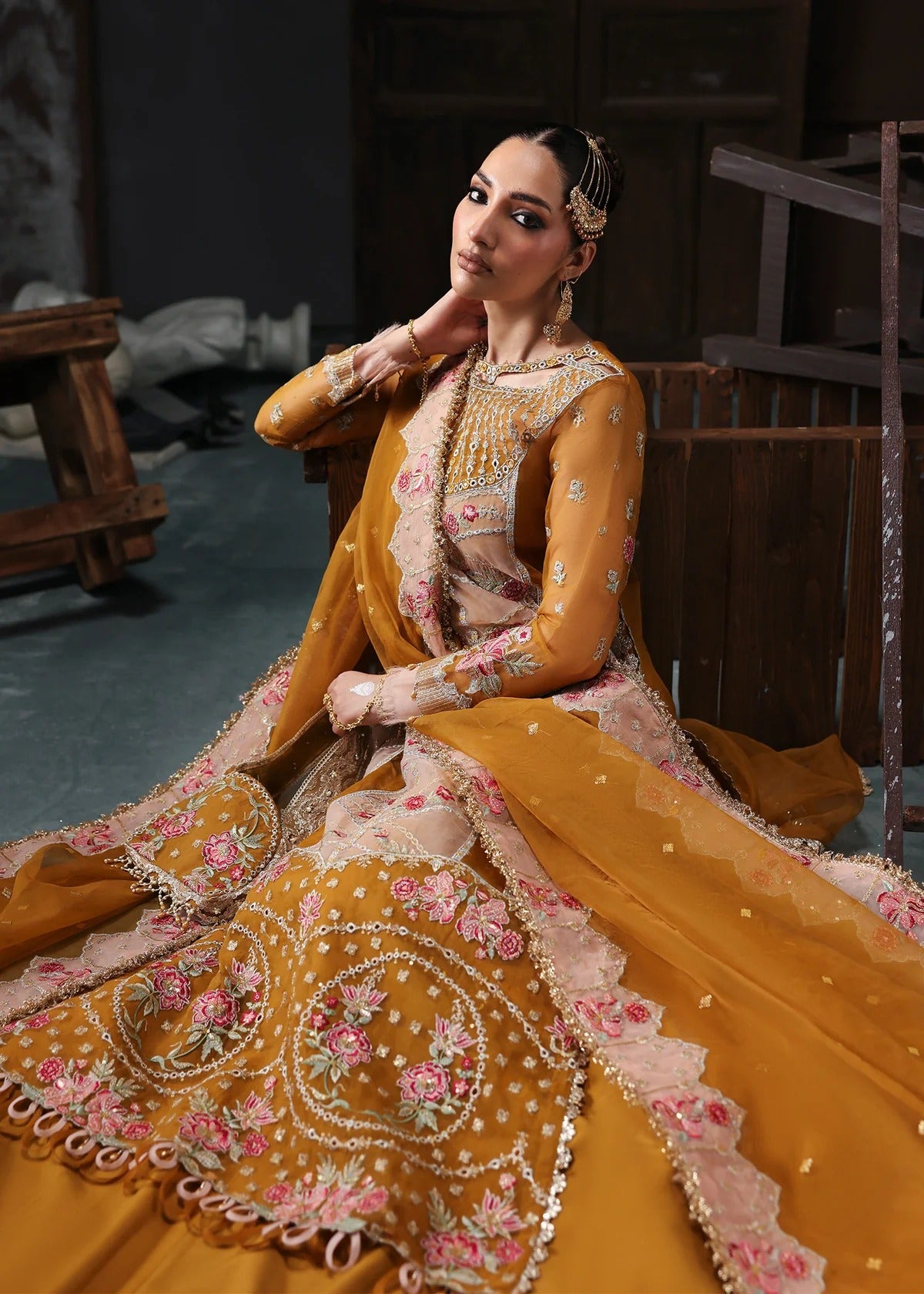Chic mustard organza suit with applique front, embroidered neckline, dupatta with 4-side border, and raw silk trouser — perfect for festive wear.