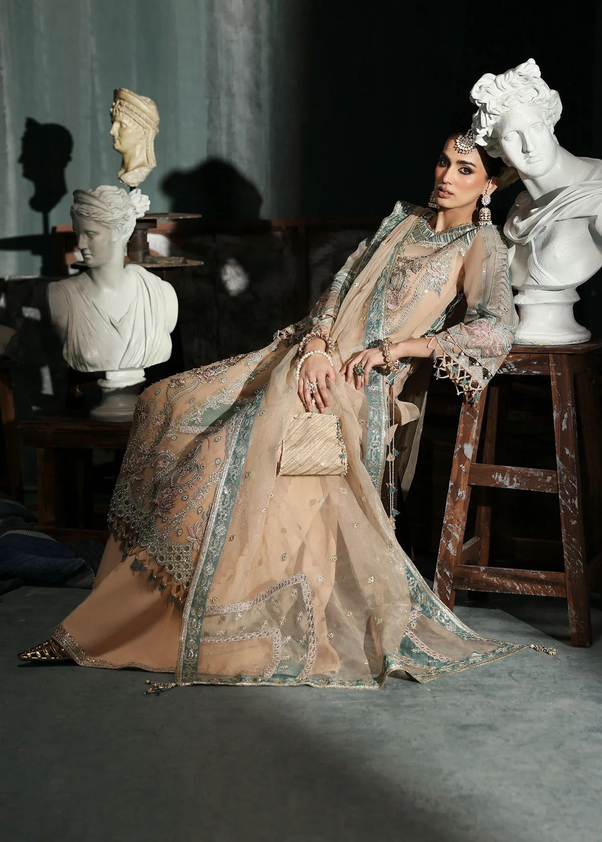 Elegant pale pink organza suit with dori work panels, applique neckline, embroidered dupatta, and raw silk trouser — perfect for festive occasions.