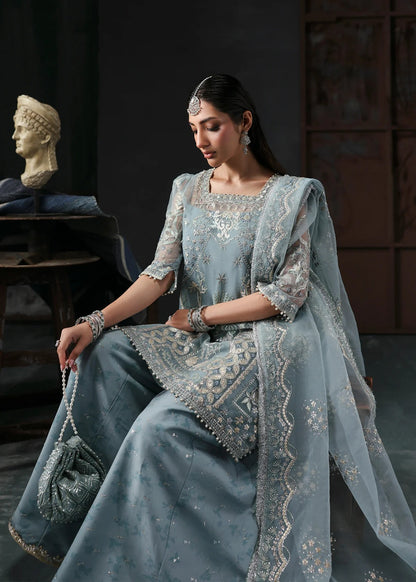 Chic ice blue organza dress with embroidered panels, dupatta & raw silk trouser. Available stitched/unstitch with custom sizing & worldwide delivery.
