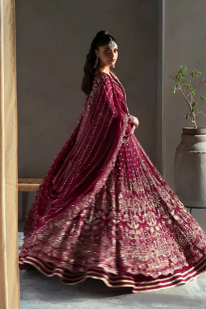 Graceful chiffon dress featuring 12" embroidered panels, elegant sleeves, and organza borders, paired with a matching dupatta and soft raw silk inner.